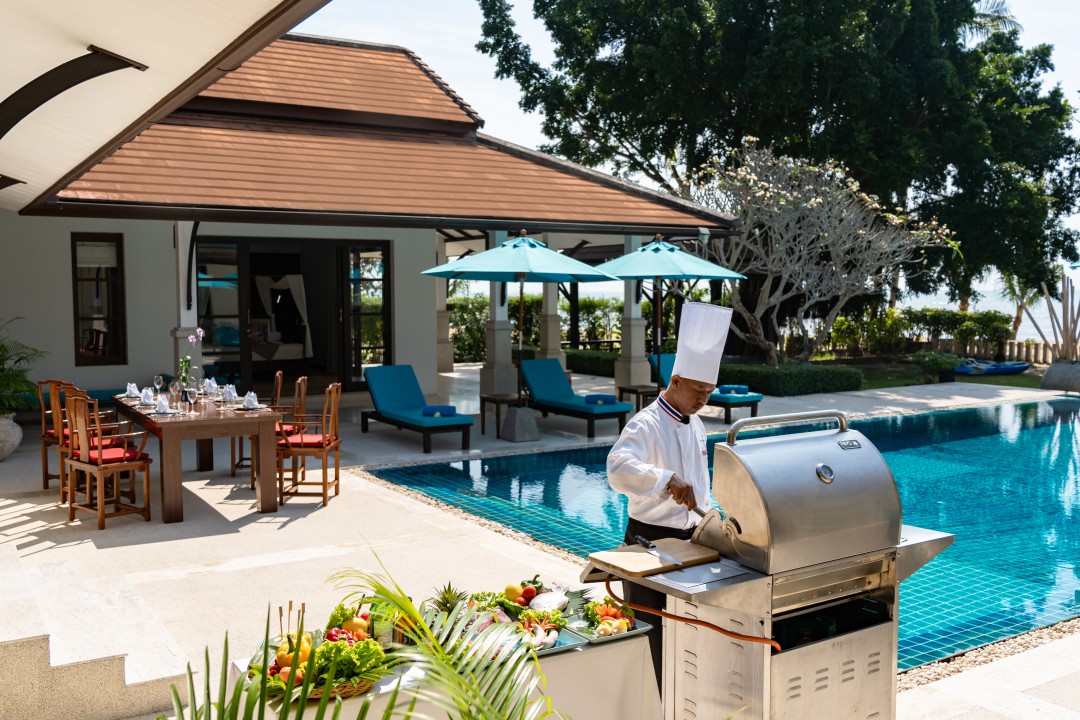 44 Chef preparing BBQ by the pool